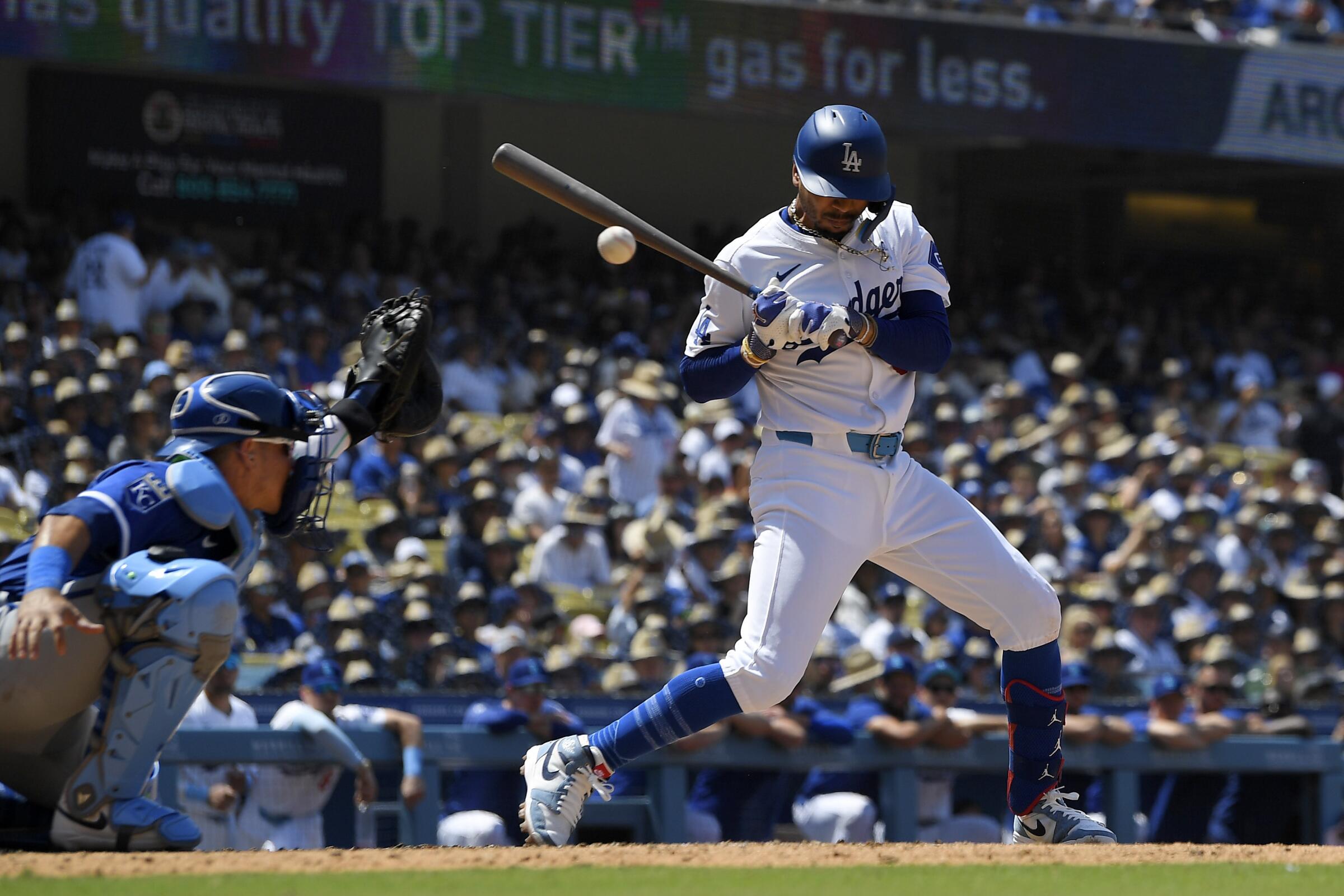 Dodgers star Mookie Betts takes a pitch off his left hand during an at-bat at Dodger Stadium.
