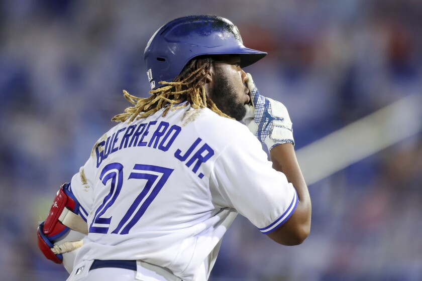 Toronto Blue Jays' Vladimir Guerrero Jr. gestures rounding third base after hitting his third home run against the Washington Nationals during the seventh inning of a baseball game Thursday, April 27, 2021, in Dunedin, Fla. (AP Photo/Mike Carlson)