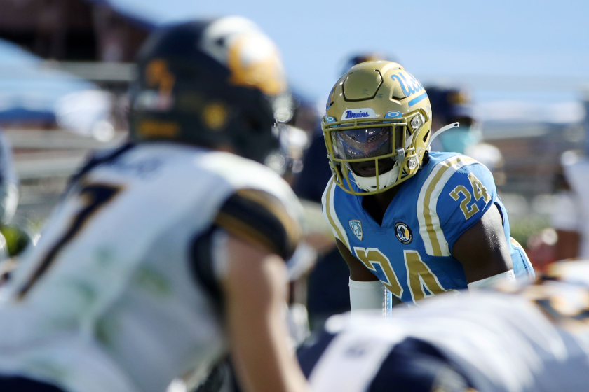 Qwuantrezz Knight #24 of the UCLA Bruins looks at Chase Garbers #7 of the California Golden Bears 