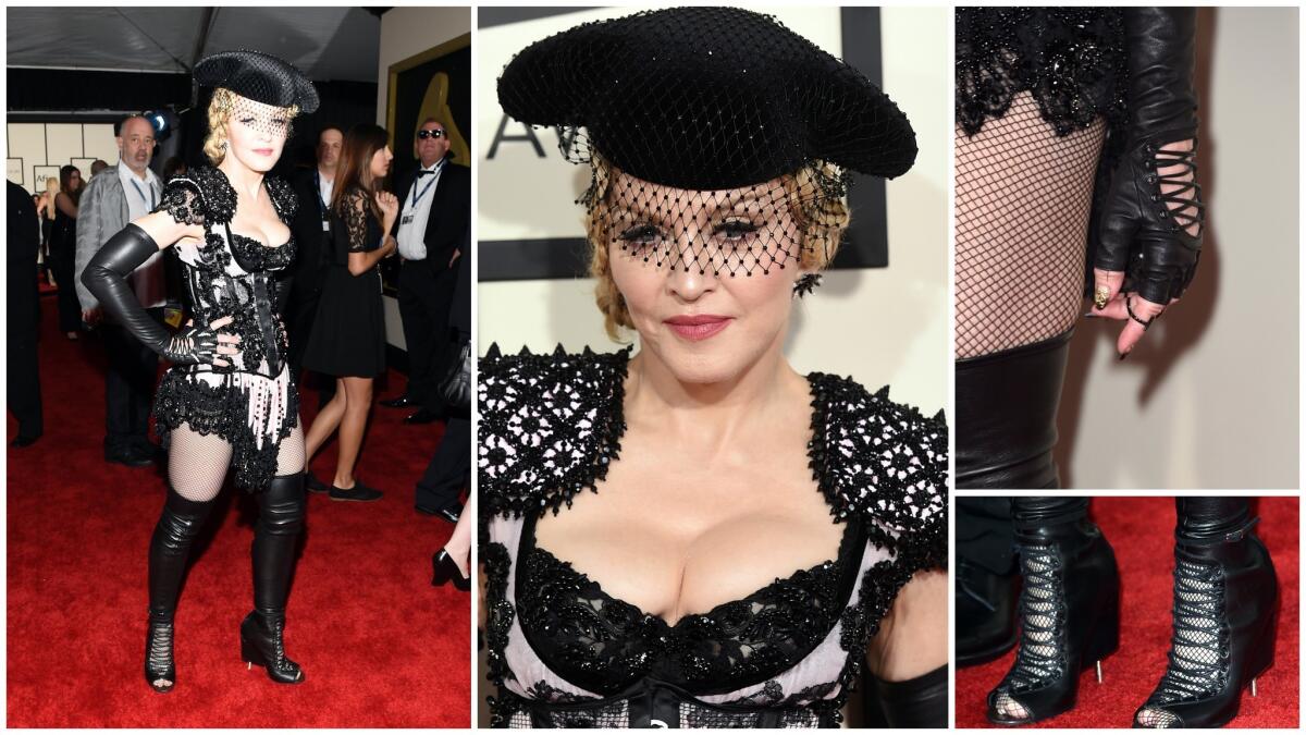 Trying too hard. Madonna's Givenchy burlesque matador outfit is a dizzy spell of details -- epaulets, fringe, face veil, hat, over-the-knee-boots and more.