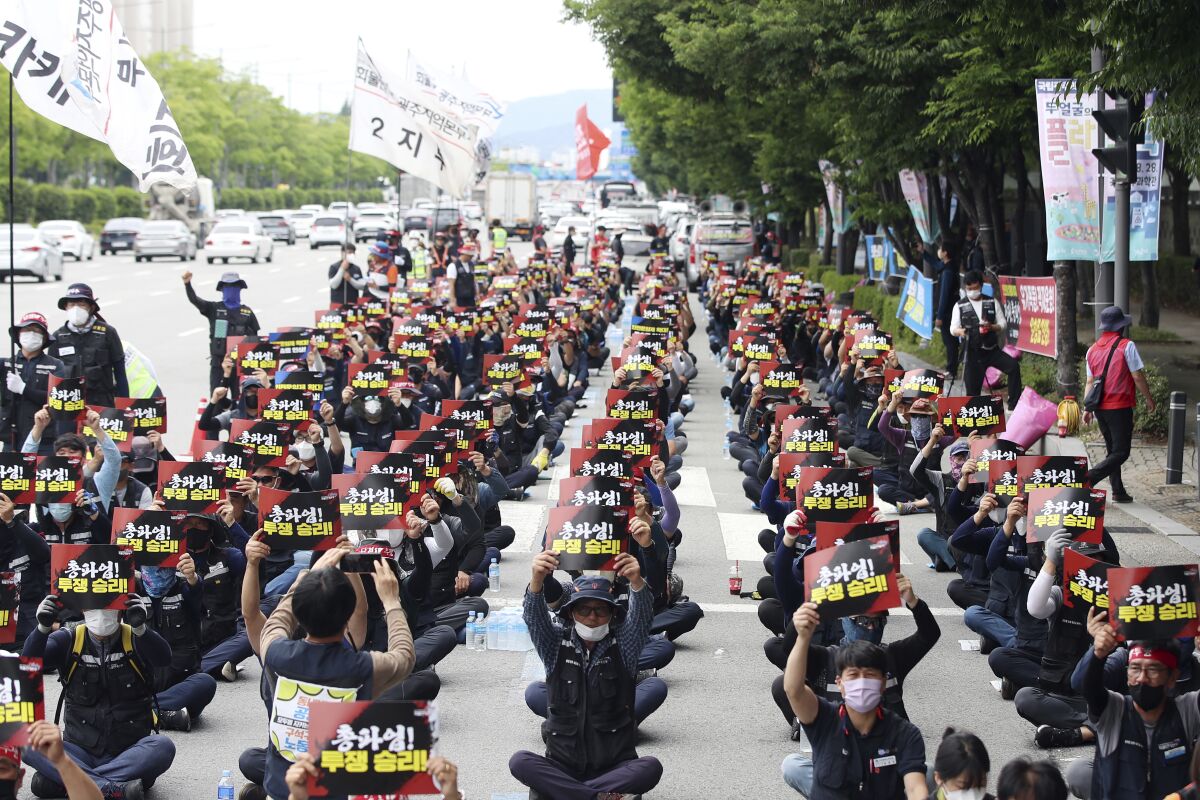 Members of Cargo Truckers Solidarity of the Korean Confederation of Trade Unions shout slogans during a rally in Gwangju, South Korea, Friday, June 10, 2022. (Chung Jung-in/Yonhap via AP)