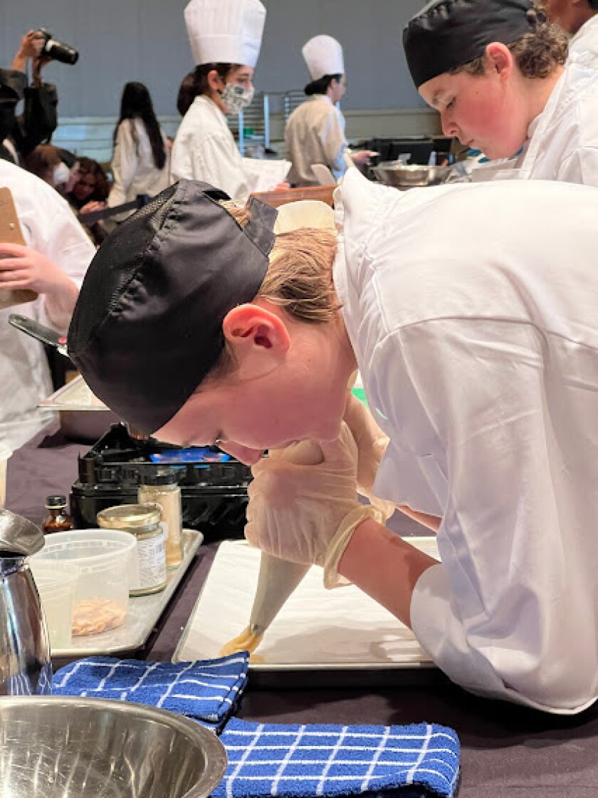 NHHS junior Trixie Kulik makes churros Monday at the CA ProStart Cup culinary competition.