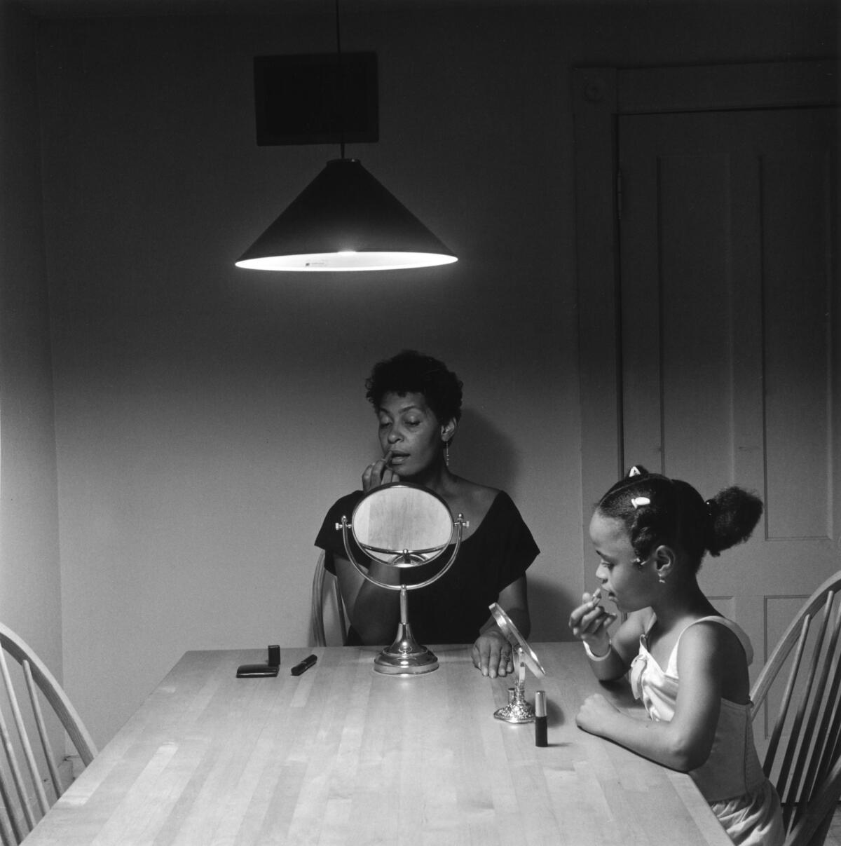 Carrie Mae Weems' Untitled (Woman and daughter with makeup), from Kitchen Table Series, 1990 (Copyright Carrie Mae Weems. Courtesy of the artist and Jack Shainman Gallery, New York)