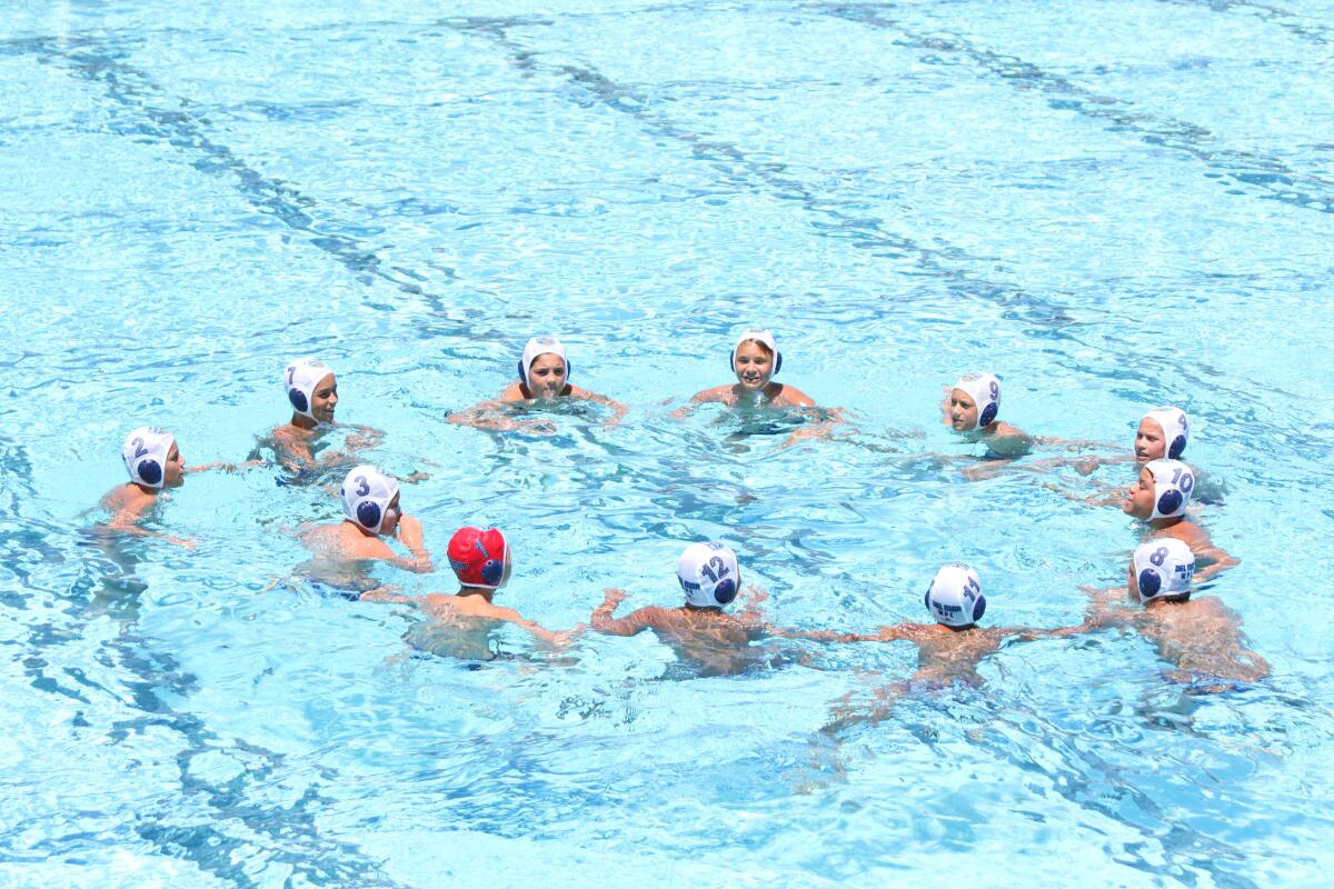 Del Mar Water Polo Club’s 12 & under Boys A team members in the pool.