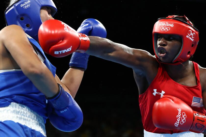 American boxer Claressa Shields connects with an overhand right during her bout against Dariga Shakimova of Kazakhstan on Friday.