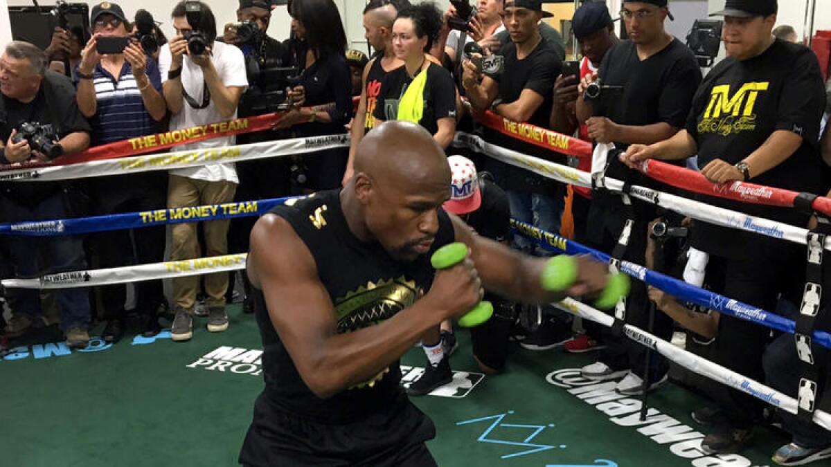 Boxing champion Floyd Mayweather Jr., shown at a workout, is unbeaten.