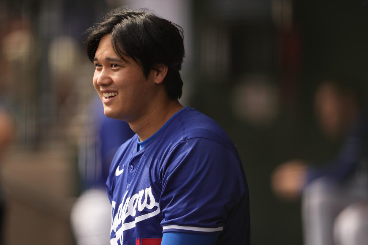 Shohei Ohtani reacts in the dugout.