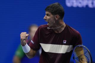 Alexei Popyrin, of Australia, reacts against Novak Djokovic, of Serbia, during a third round match.