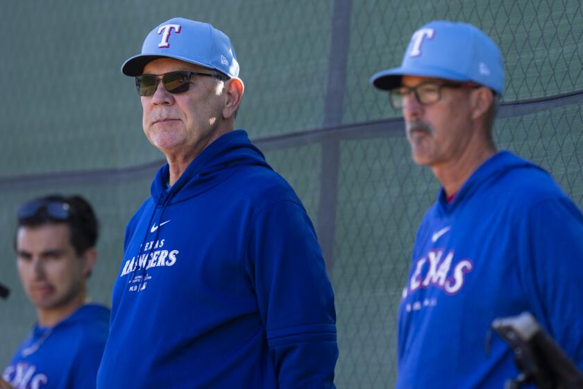 SURPRISE, AZ - FEBRUARY 14: Manager Bruce Bochy #15 of the Texas Rangers looks on during a spring training workout at Surprise Stadium on February 9, 2024 in Surprise, Arizona. (Photo by Bailey Orr/Texas Rangers/Getty Images)