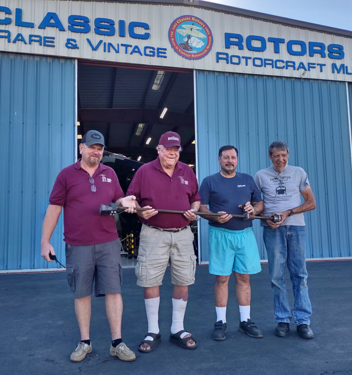 Holding a jackscrew, L-R, Troy Gesaman and Peter Von Hagen of All Day Radios, Mark DiCiero and Joe Gwizdak of Classic Rotors.
