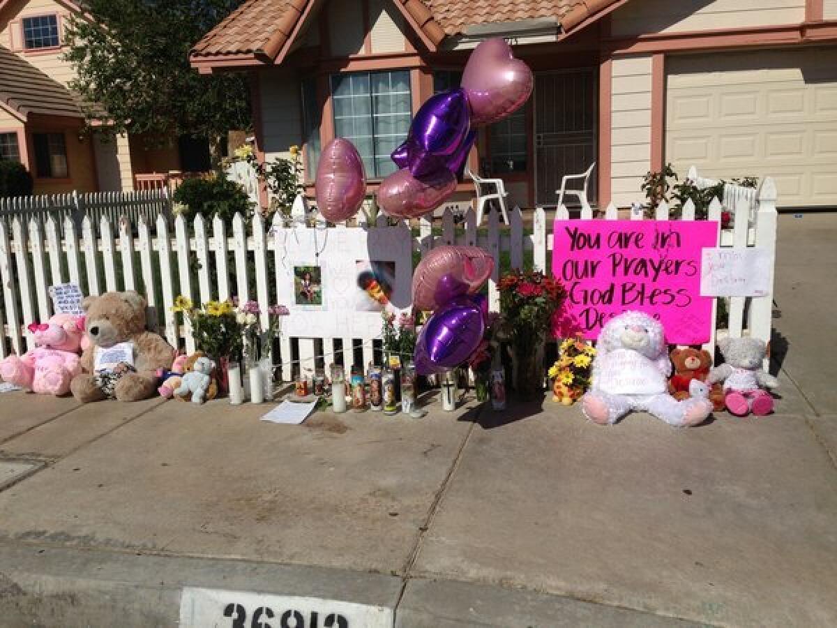 A makeshift memorial went up in front of the home of a 7-year-old Palmdale girl who was shot Wednesday morning and remains on life support.