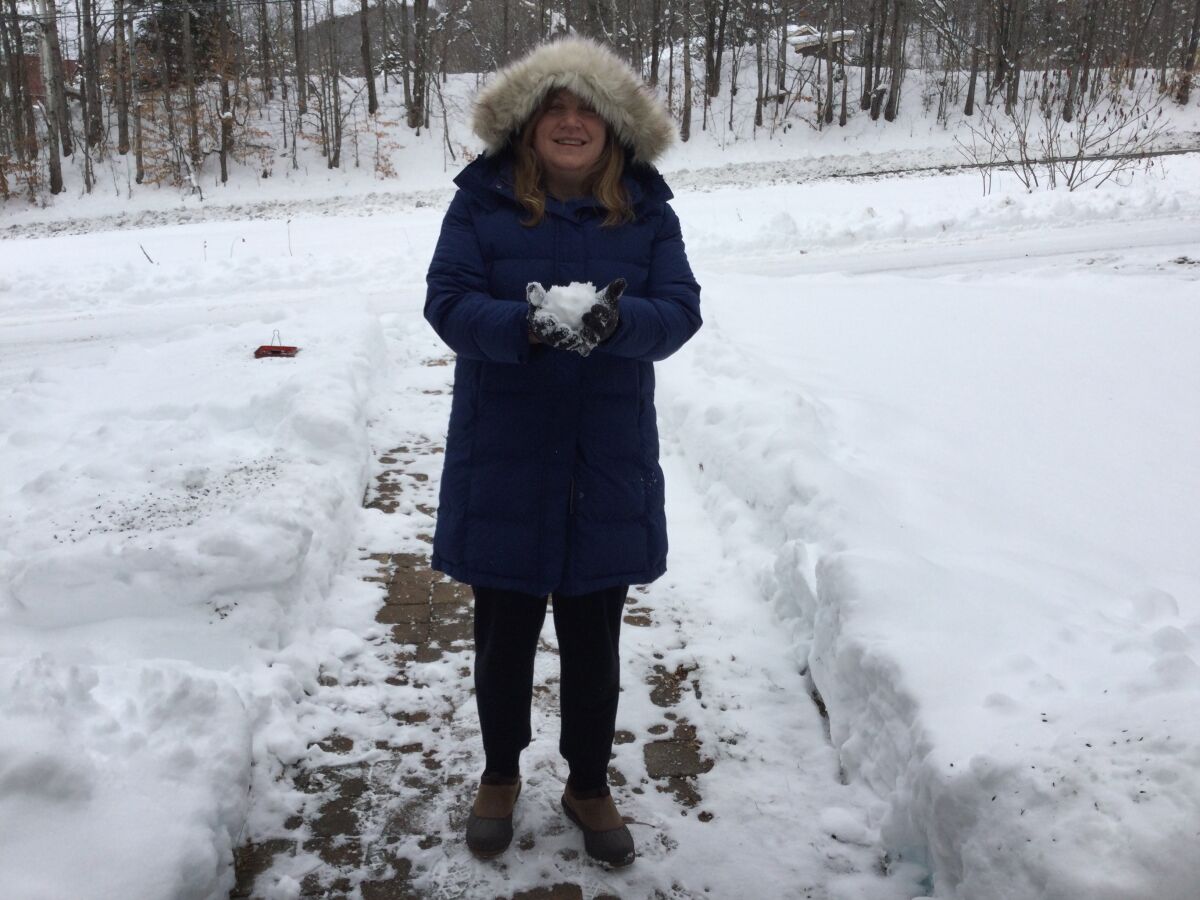 Jodi Cilley holds a snowball in Topsham, Vermont.