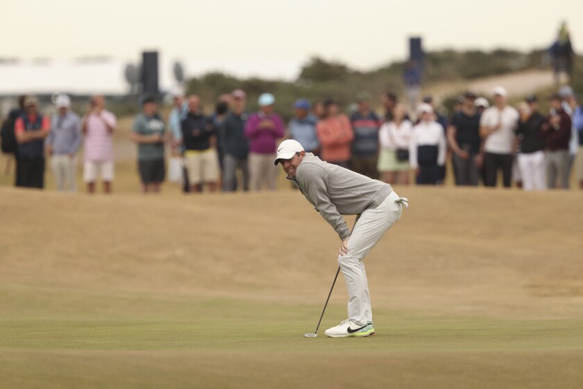 Rory McIlroy of Northern Ireland reacts after missing a putt on the 12th green during the third round of the British Open golf championship on the Old Course at St. Andrews, Scotland, Saturday July 16, 2022. (AP Photo/Peter Morrison)