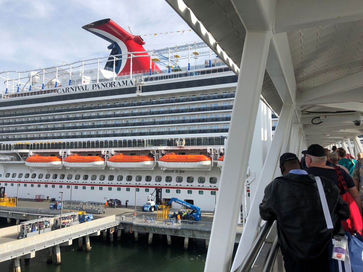 Travelers board the Panorama on Dec. 11 for its inaugural voyage out of Long Beach.