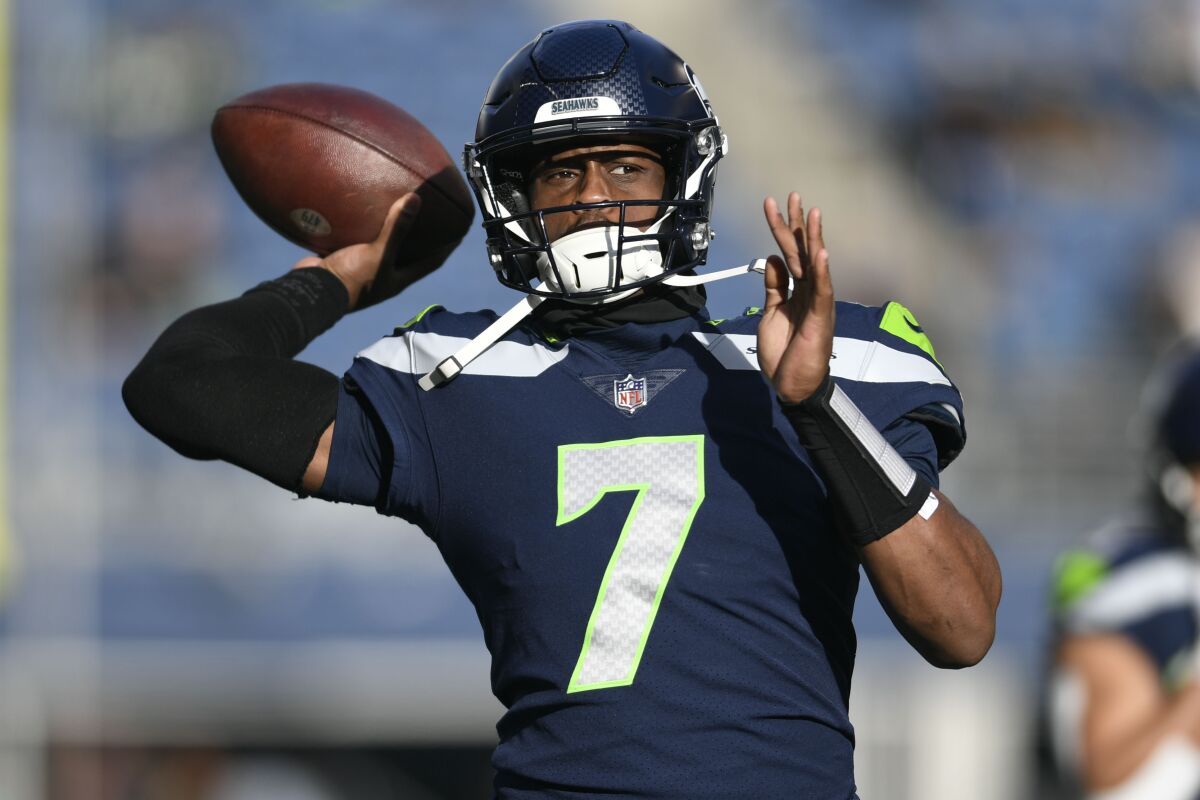 Seattle Seahawks quarterback Geno Smith warms up before a game against the Las Vegas Raiders November 27.