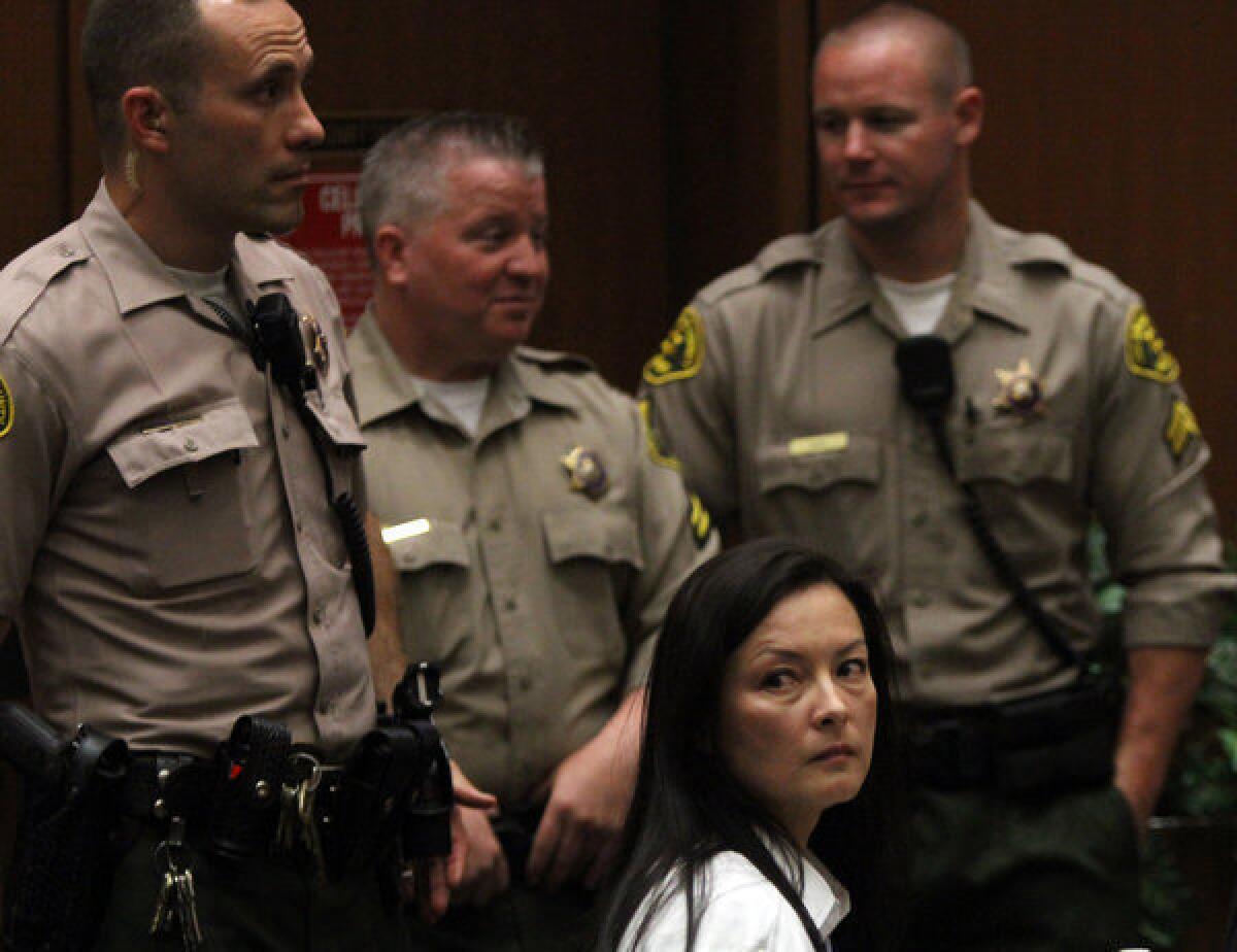 Kelly Soo Park looks back at the audience as opening motions are made in her murder trial.
