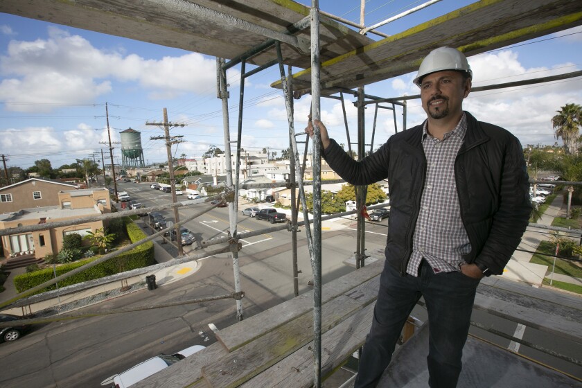 Beri Varol, the architect and developer of the Kansas Modern apartments on Kansas Street and Howard Avenue in North Park, in one of the soon to be completed units on Thursday, January 09, 2020 with a view of the iconic North Park water tower in the background.