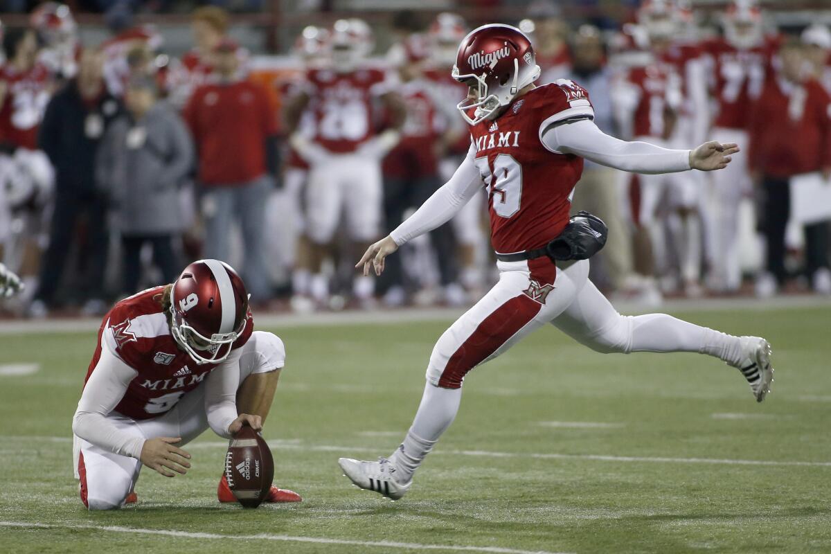 Miami of Ohio kicker Sam Sloman sets to kick a field goal.