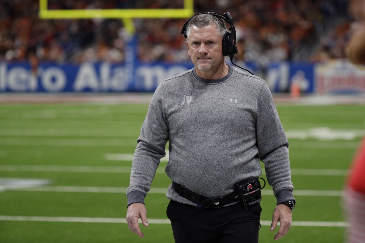 Utah coach Kyle Whittingham walks on the sideline.