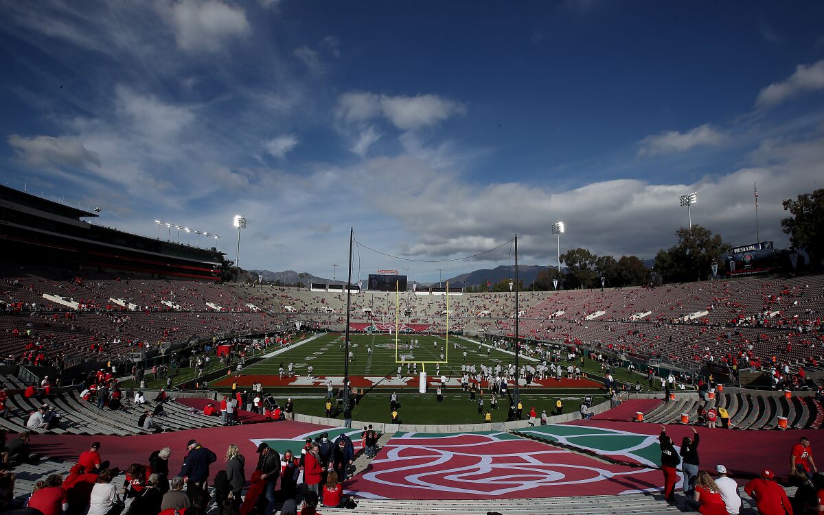 Ohio State and Utah fans take their seats before the Rose Bowl on Saturday.