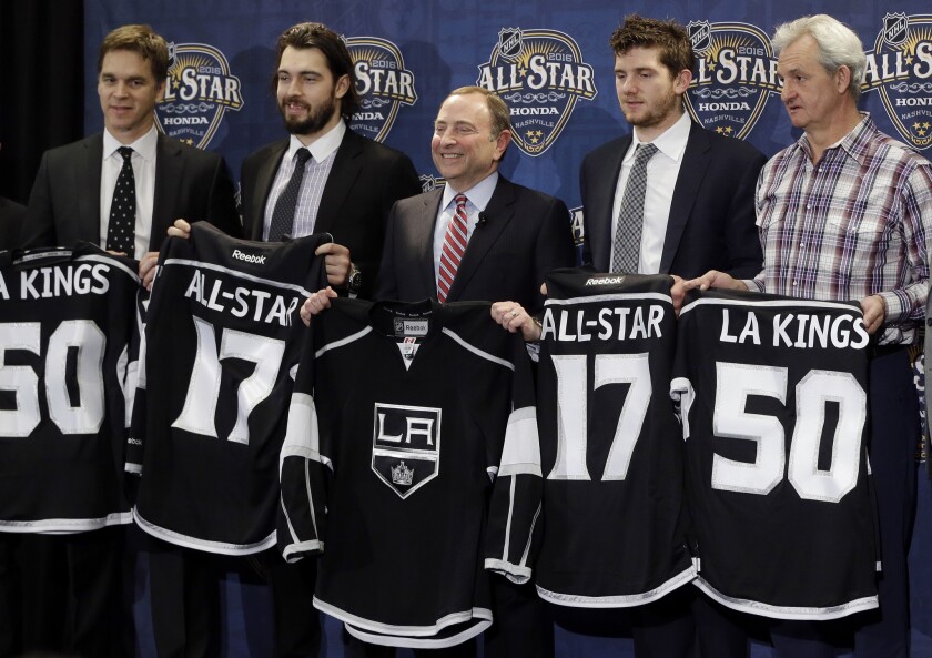 NHL Commissioner Gary Bettman, center, is joined by members of the Kings after it was announced that the 2017 NHL hockey All-Star game will be held in Los Angeles.