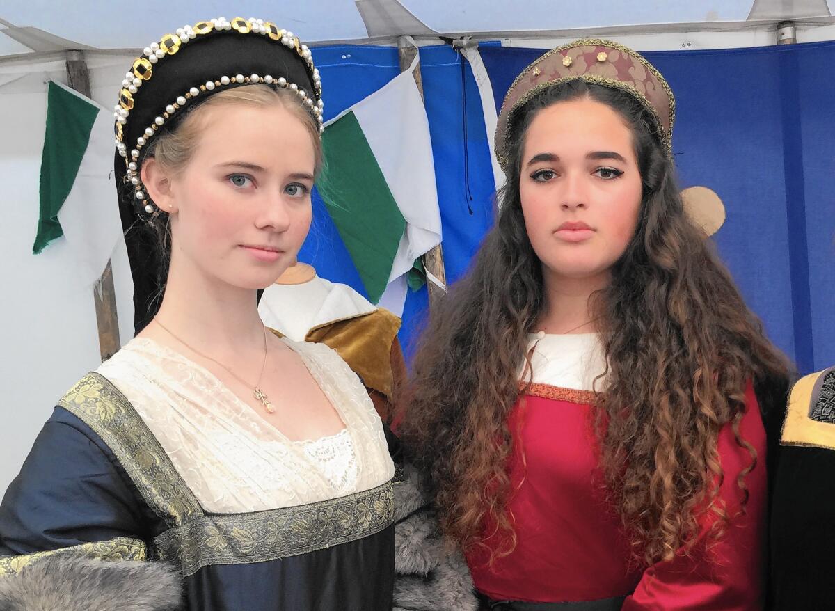 From left, Jamie Ostmann and Rachel Charny dress in Tudor costumes at the Royal Academy of Dramatic Art in London over the summer.
