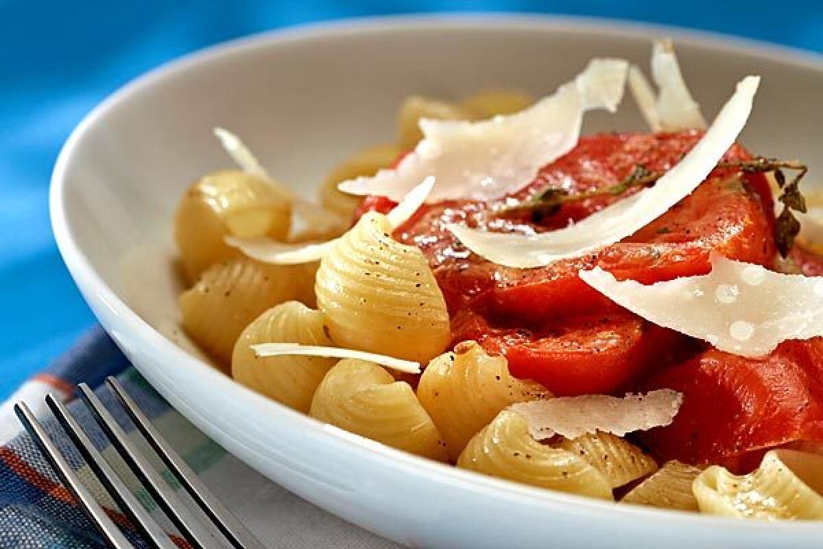 Tomatoes roasted beneath a blanket of bacon become a bright yet smoky confit, great with pasta.