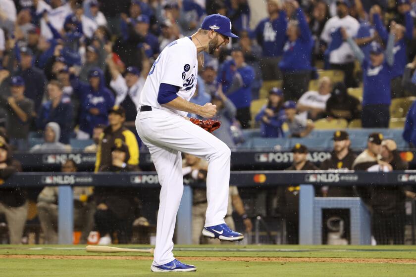 Dodgers relief pitcher Chris Martin reacts after striking out San Diego Padres' Ha-Seong Kim