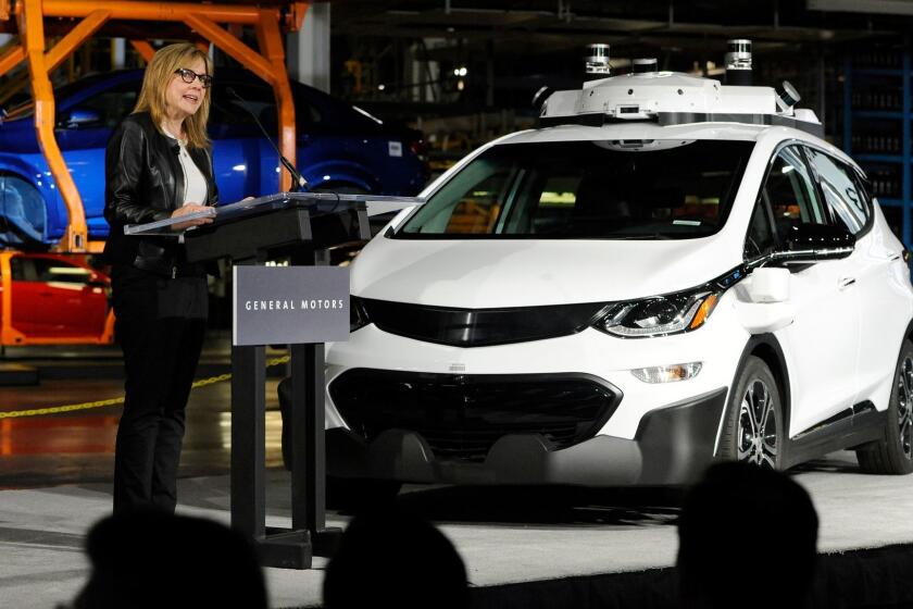 General Motors Chairman and CEO Mary Barra updates the media on the company's autonomous vehicle development program, Tuesday, June 13, 2017, at GM's Orion Assembly in Lake Orion, Mich. Barra stands next to a self-driving Chevrolet Bolt EV, one of 130 the company has built at a factory in suburban Detroit, making it among the first automakers to mass produce self-driving vehicles. (Jose Juarez/Detroit News via AP)
