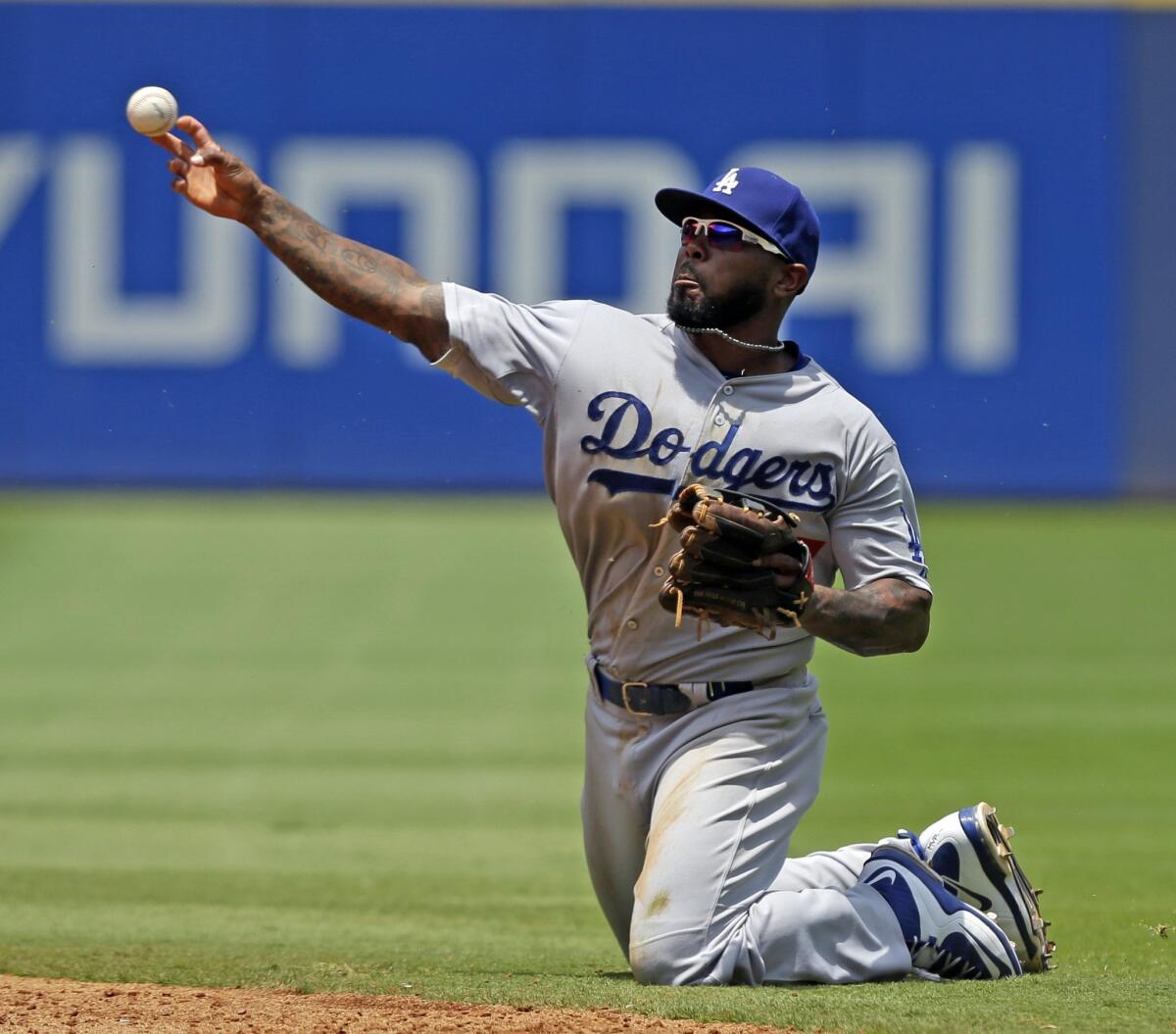 Dodgers second baseman Howie Kendrick throws to first after fielding a ground ball against the Atlanta Braves on Wednesday.