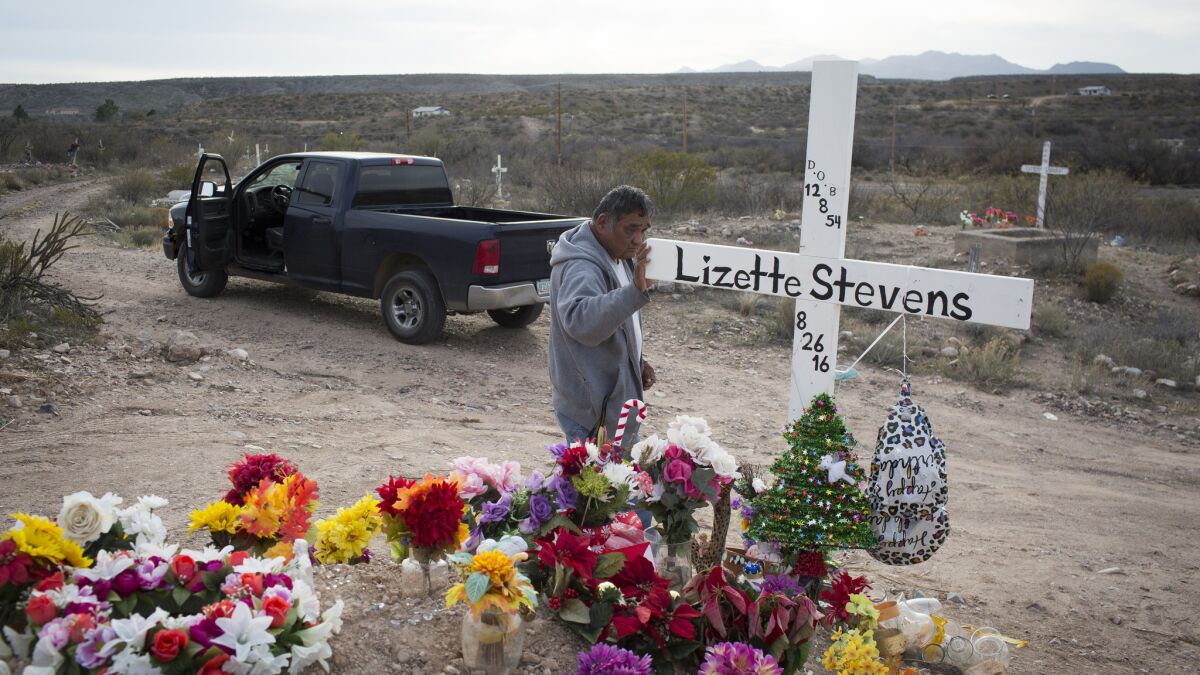 Mike Stevens visits the grave of his late wife, Lizette, on the reservation. Lizette's mother, sister and aunt died within a few years of one another in the 1980s and 1990s.