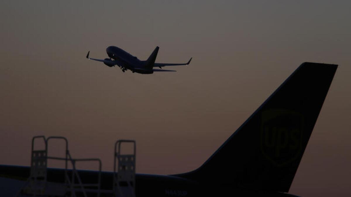 A plane takes off from John Wayne Airport.