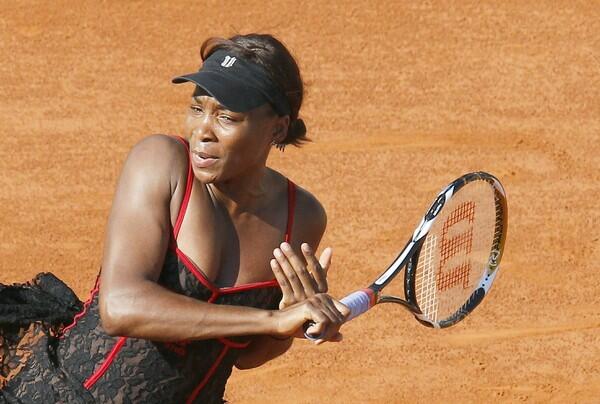 Venus Williams of the US plays a return