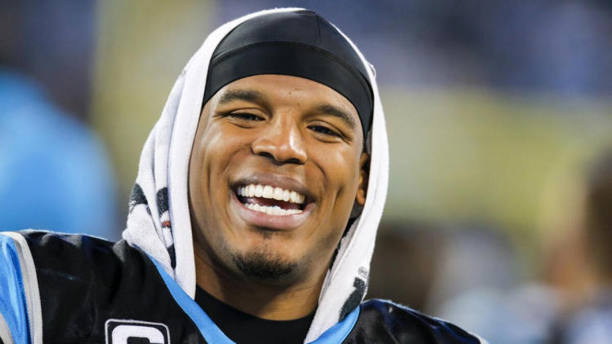 Carolina Panters Quarterback Cam Newton smiles during a game.