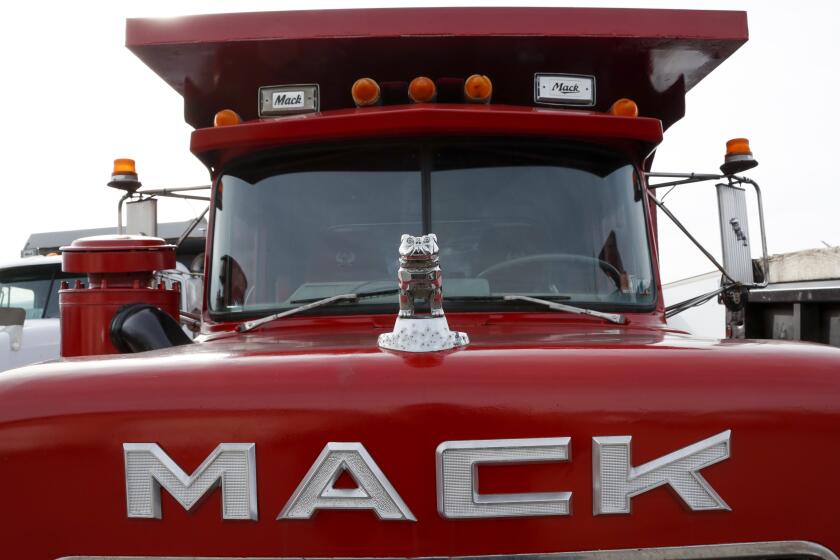 File - A hood ornament is seen on a used Mack truck on a lot in Evans City, Pa., Jan. 9, 2020. Union workers at Mack Trucks have voted down a tentative five-year contract agreement reached with the company. (AP Photo/Keith Srakocic, File)