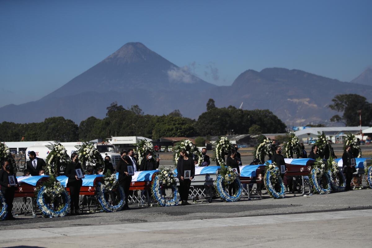 The flag-draped coffins of Guatemalan migrants