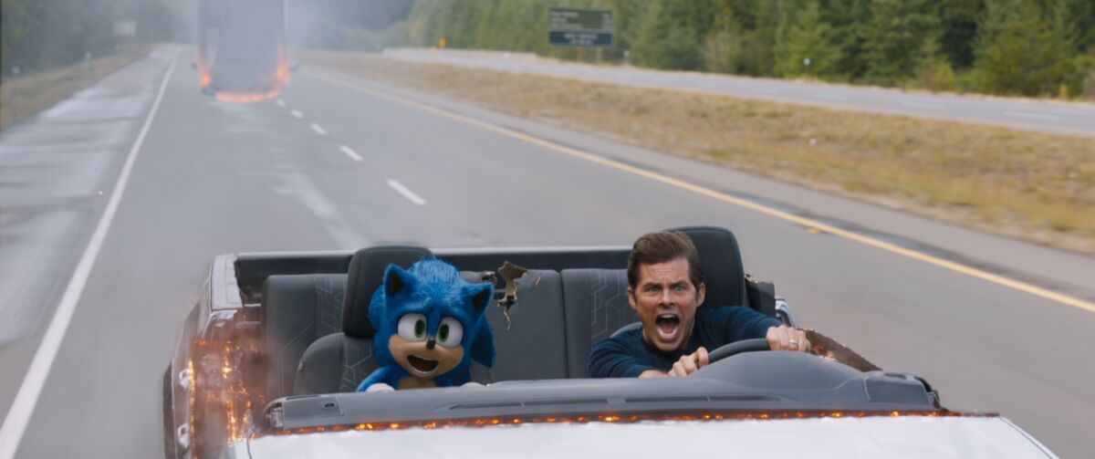 Sonic (voiced by Ben Schwartz) and James Marsden in the movie "Sonic the Hedgehog."
