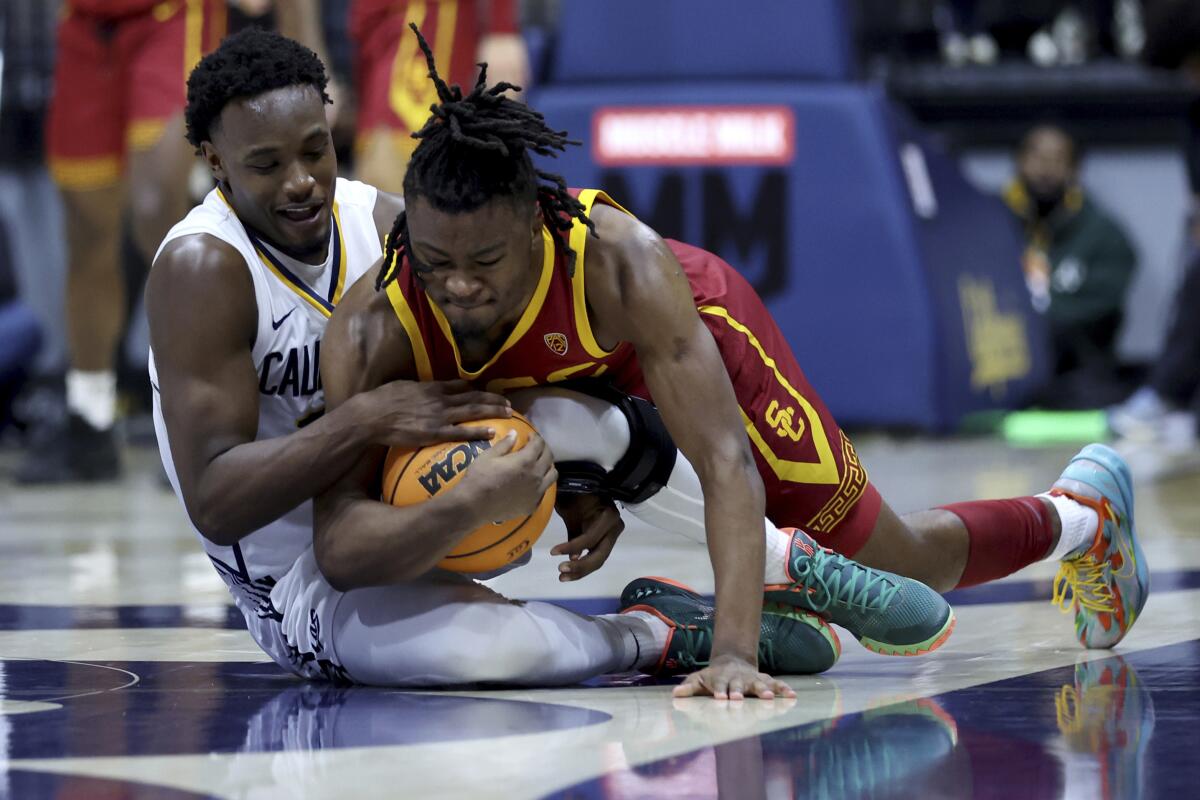 USC's Isaiah Collier, right, and Cal guard Jalen Celestine vie for the ball in the second half.