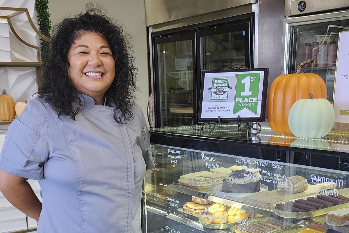 Maria Short poses in her bakery, Short 'N Sweet, in Hilo, Hawaii on Nov. 8, 2022. Higher prices are hitting everyone this holiday, but food vendors are seeing some of the biggest increases. (Maria Short via AP)