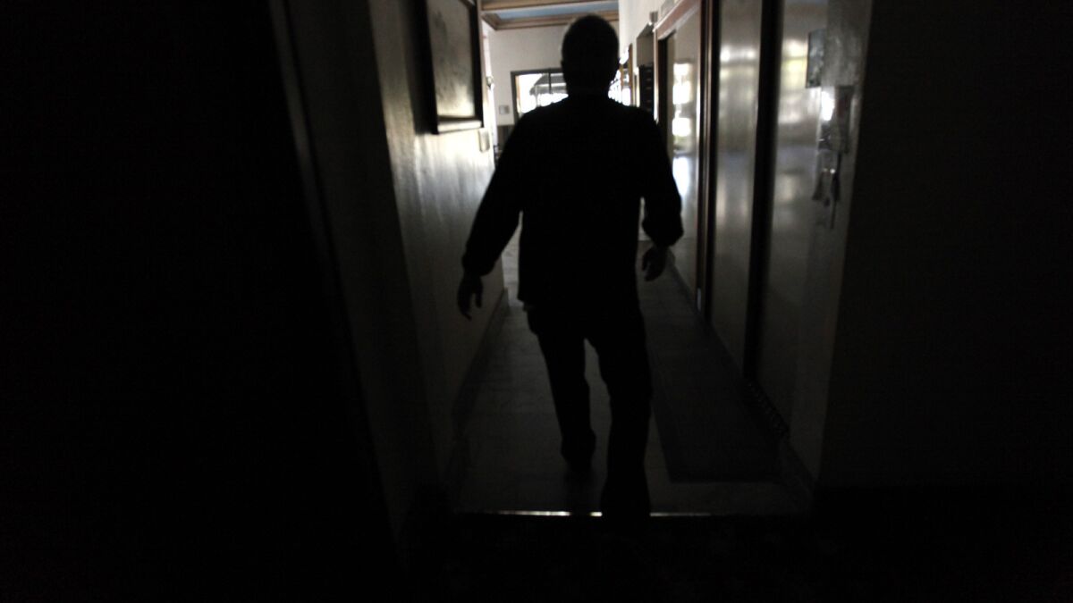 A power failure in Long Beach caused scenes like this one inside a darkened apartment building.