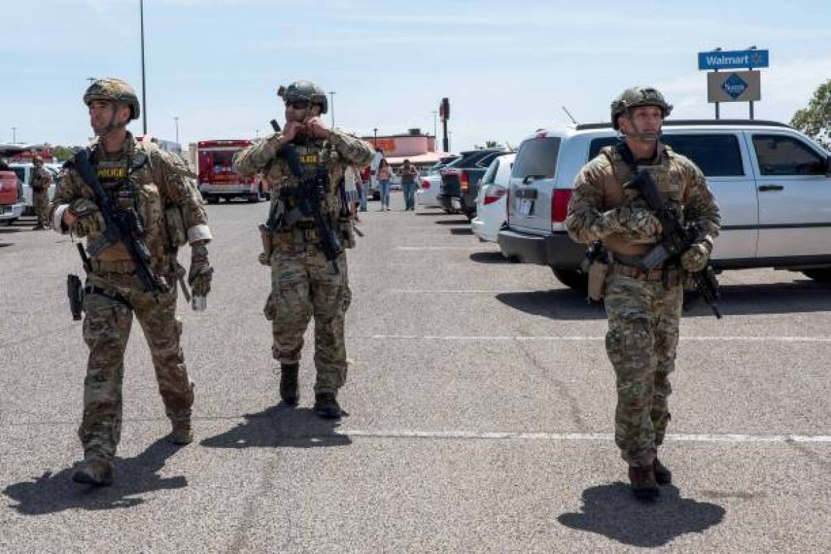 Law enforcement officials respond to a deadly shooting in El Paso.