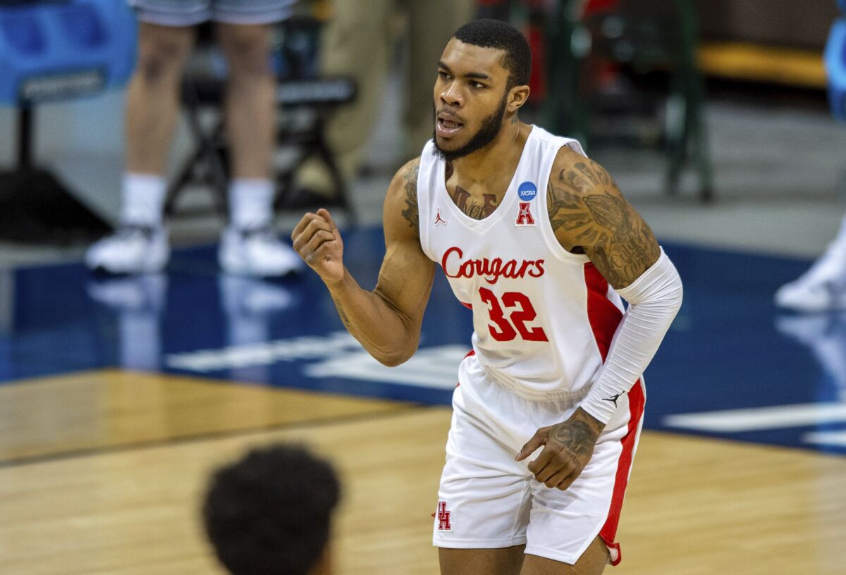 Houston forward Reggie Chaney reacts after scoring during the first half against Cleveland State on Friday.