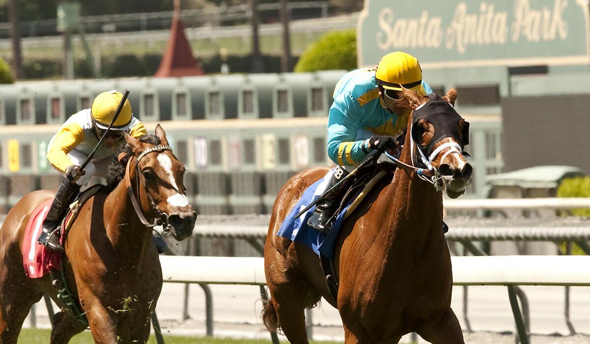 Jockey Rafael Bejarano guides On the Backstreets to victory in the Ultrafleet Stakes on Friday at Santa Anita Park. The track is suspending racing on Thursday because of excessive heat and will resume races on Friday.