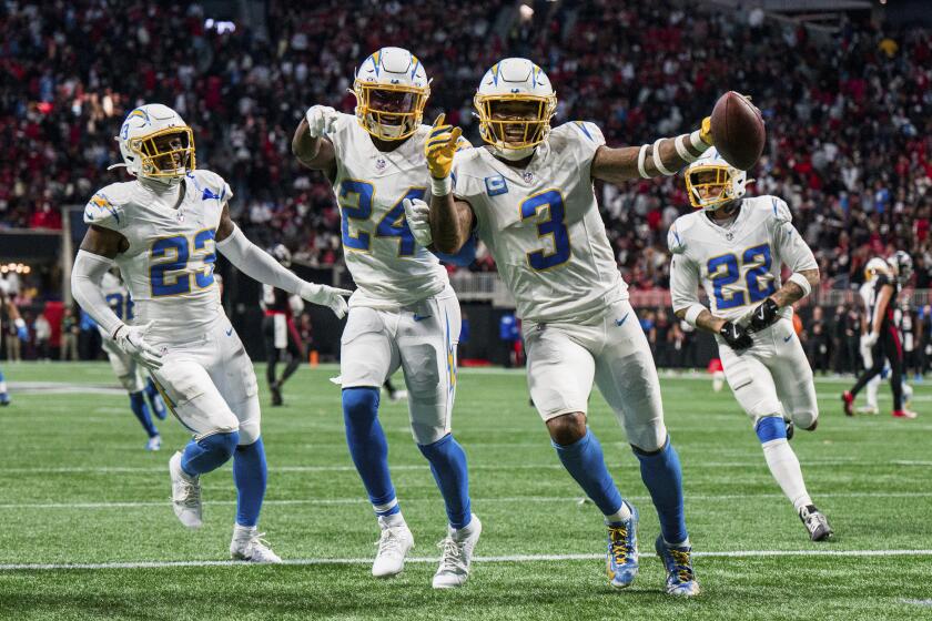 The Chargers' Derwin James Jr. (3) celebrates an interception.