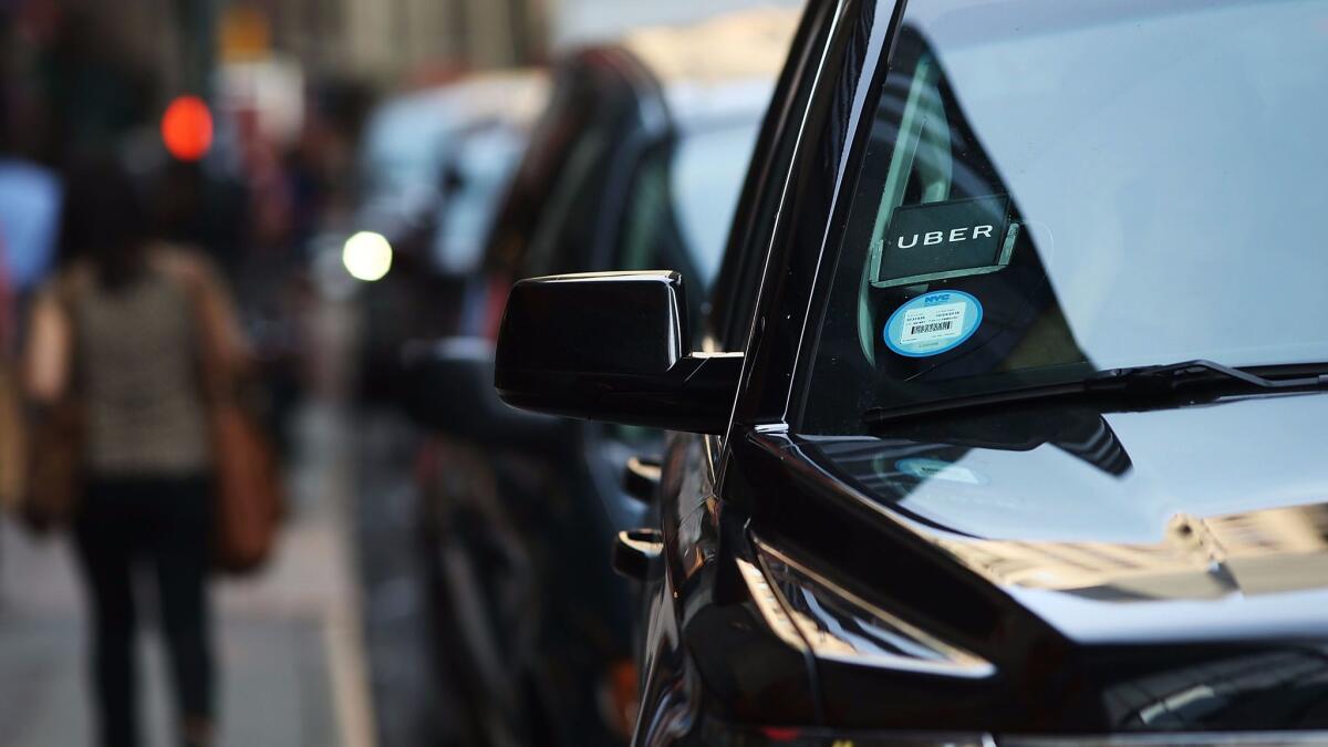 An Uber SUV waits for a client in New York in June.