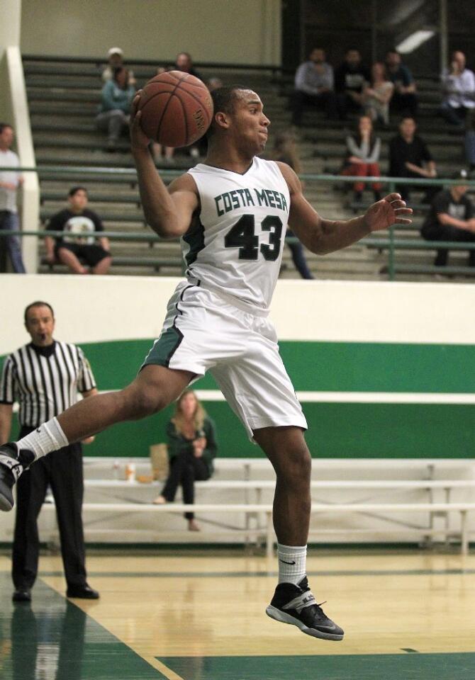 Costa Mesa High's Oronde Crenshaw (43) looks to pass during the first half against Harvard-Westlake in a CIF-Southern Section Division 4AA first-round game on Wednesday.