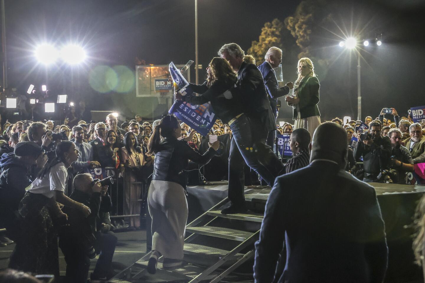 A protester is pulled off the stage at Biden rally.