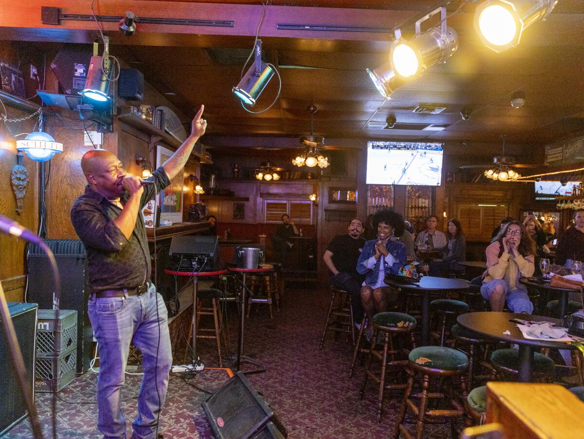 Jerome Anderson introduces a performer at the Maui Sugar Mill Saloon in Tarzana.