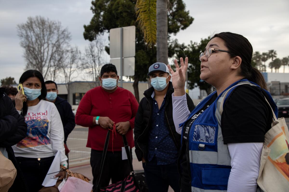 migrants at a San Diego County transit center