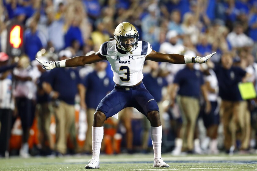 FILE - In this Thursday, Sept. 26, 2019, file photo, Navy special teams defender Cameron Kinley celebrates a missed field goal by Memphis during an NCAA college football game in Memphis, Tenn. On Tuesday, July 6, 2021, Defense Secretary Lloyd Austin said the U.S. military will allow Naval Academy graduate Kinley to pursue a career in the NFL with the Tampa Bay Buccaneers. (Joe Rondone/The Commercial Appeal via AP, File)